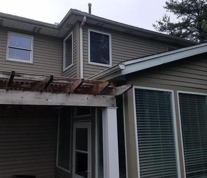 Wind damage to roof and gutters